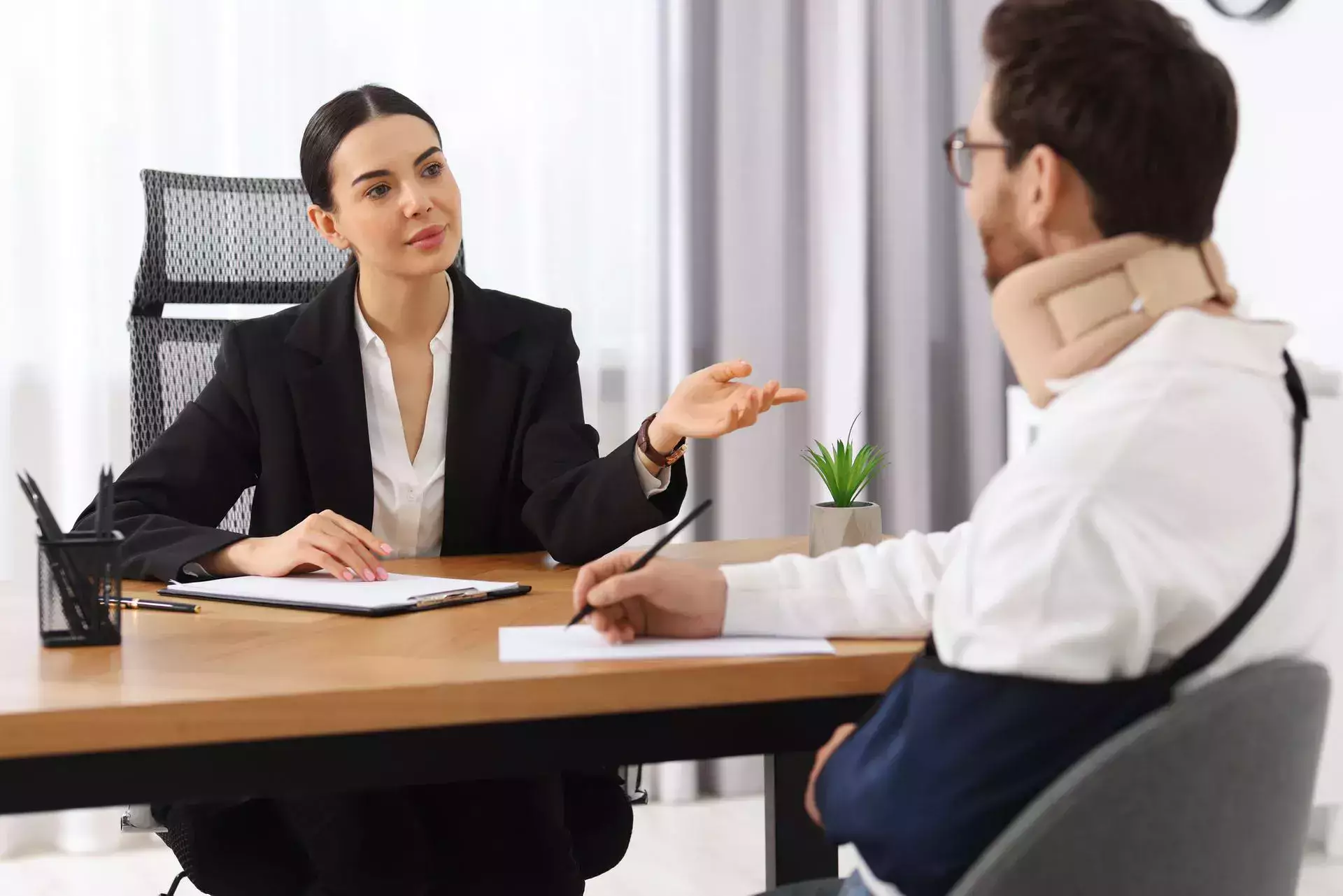 A lawyer is discussing the case with her injured client.