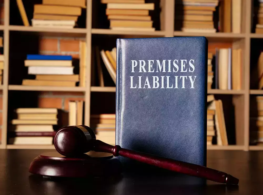 A blue book titled 'Premises Liability' next to a gavel.