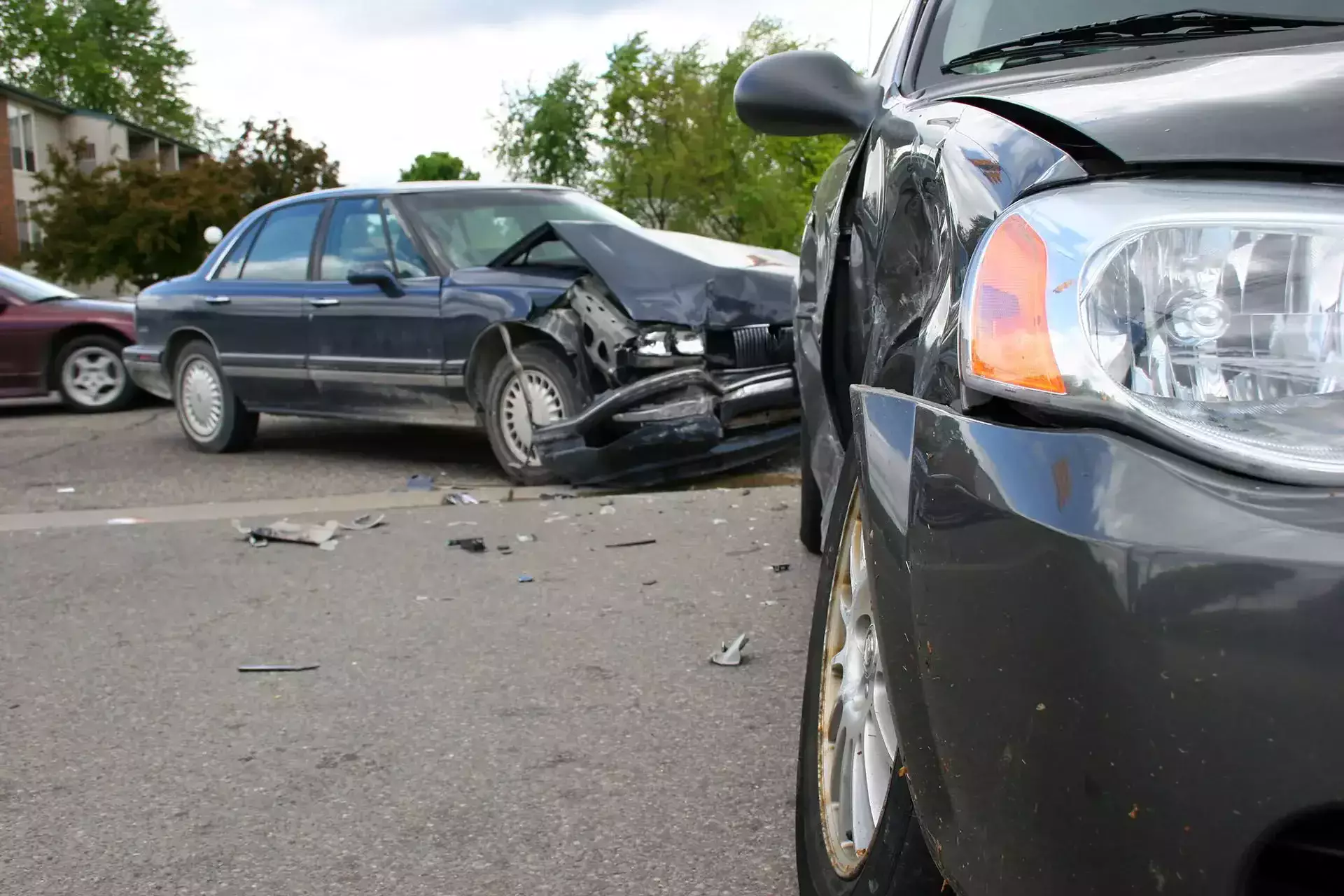 Two damaged cars after a collision on the street.