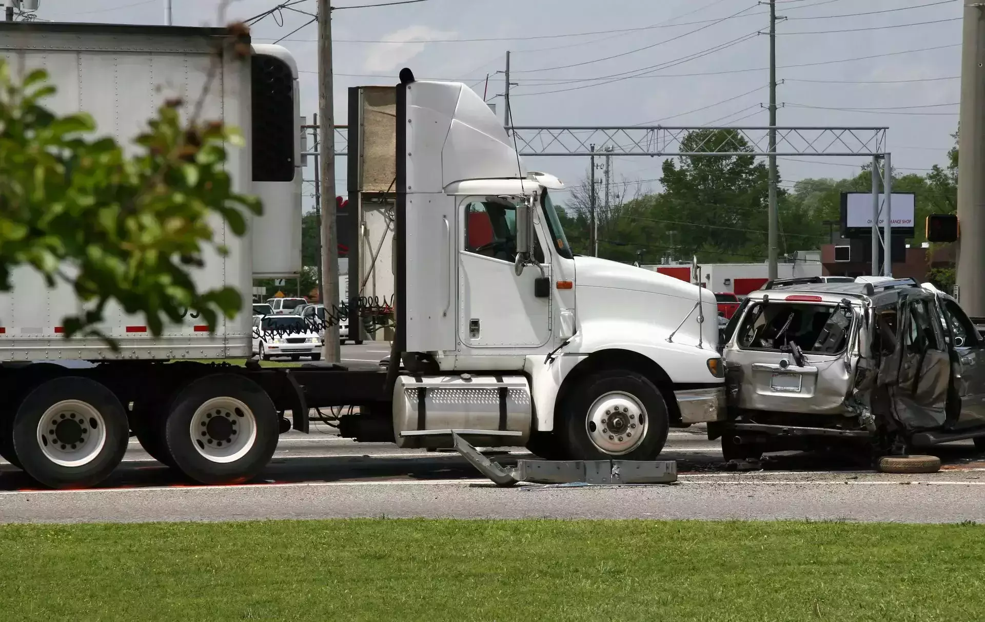 A semi-truck involved in a traffic accident with a car.