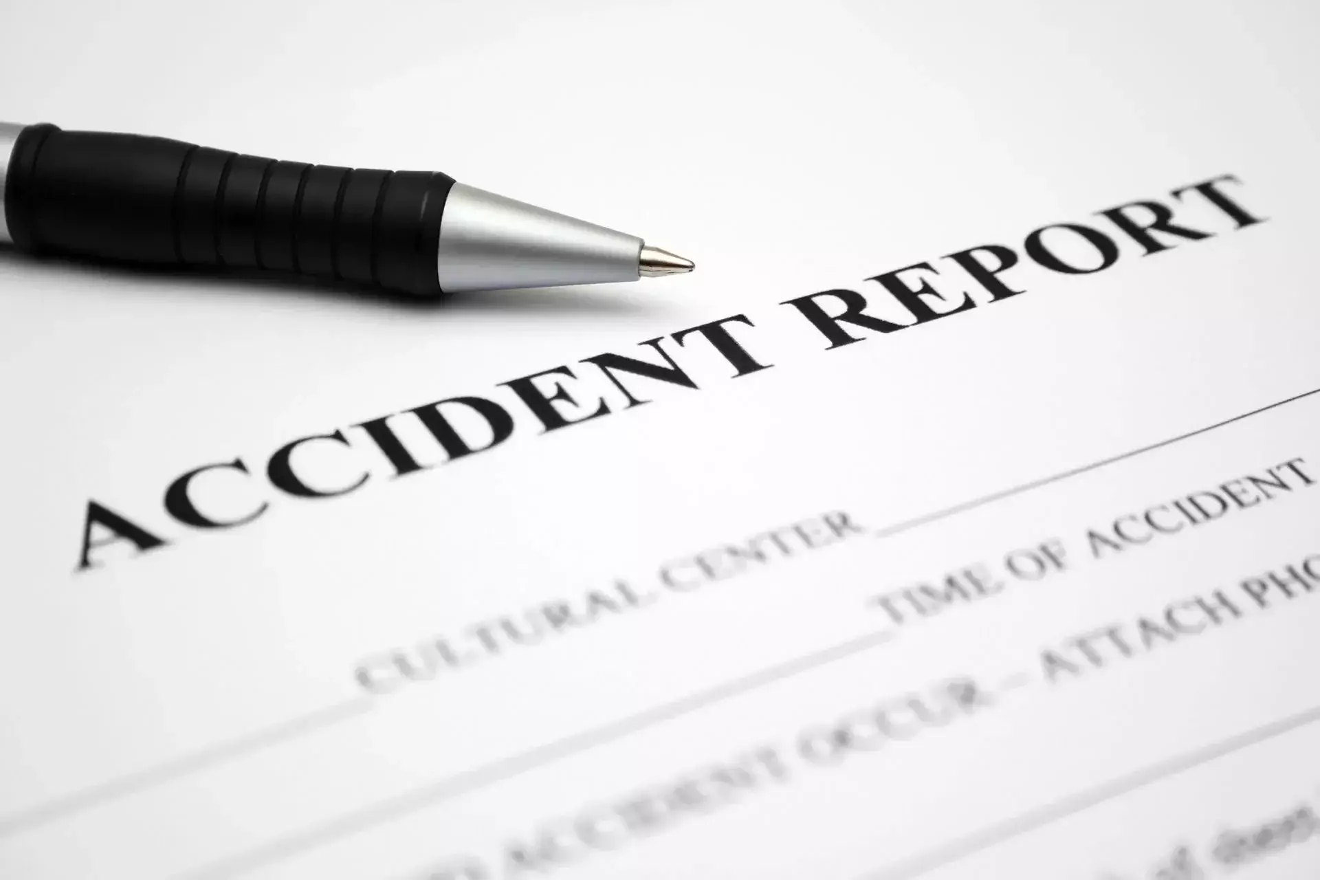 Accident report form with a pen for documenting accident details